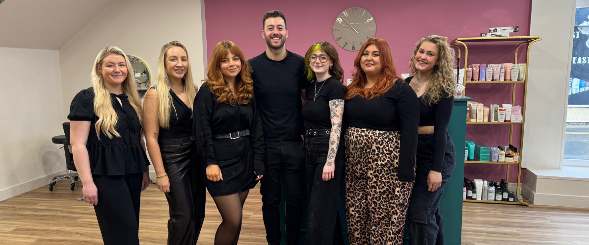 Saks Redcar hairdressing team standing in the salon's reception area.