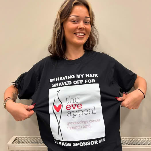 Izzy from Saks Hair & Beauty Sedbury Hall raising money for The Eve Appeal, wearing her black branded tshirt